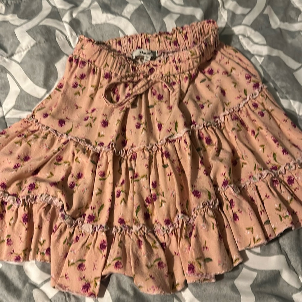 Miss Selfie medium pink skirt with flowers.